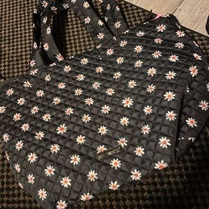Simply southern tote bag black with little flowers on it it is new.